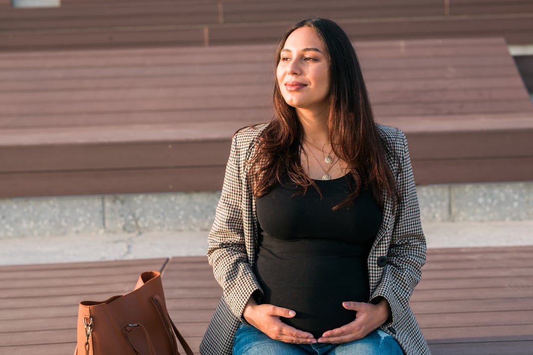 Urban Portrait of a Modern Pregnant Latina Woman. Pregnancy and Parenthood Concept.